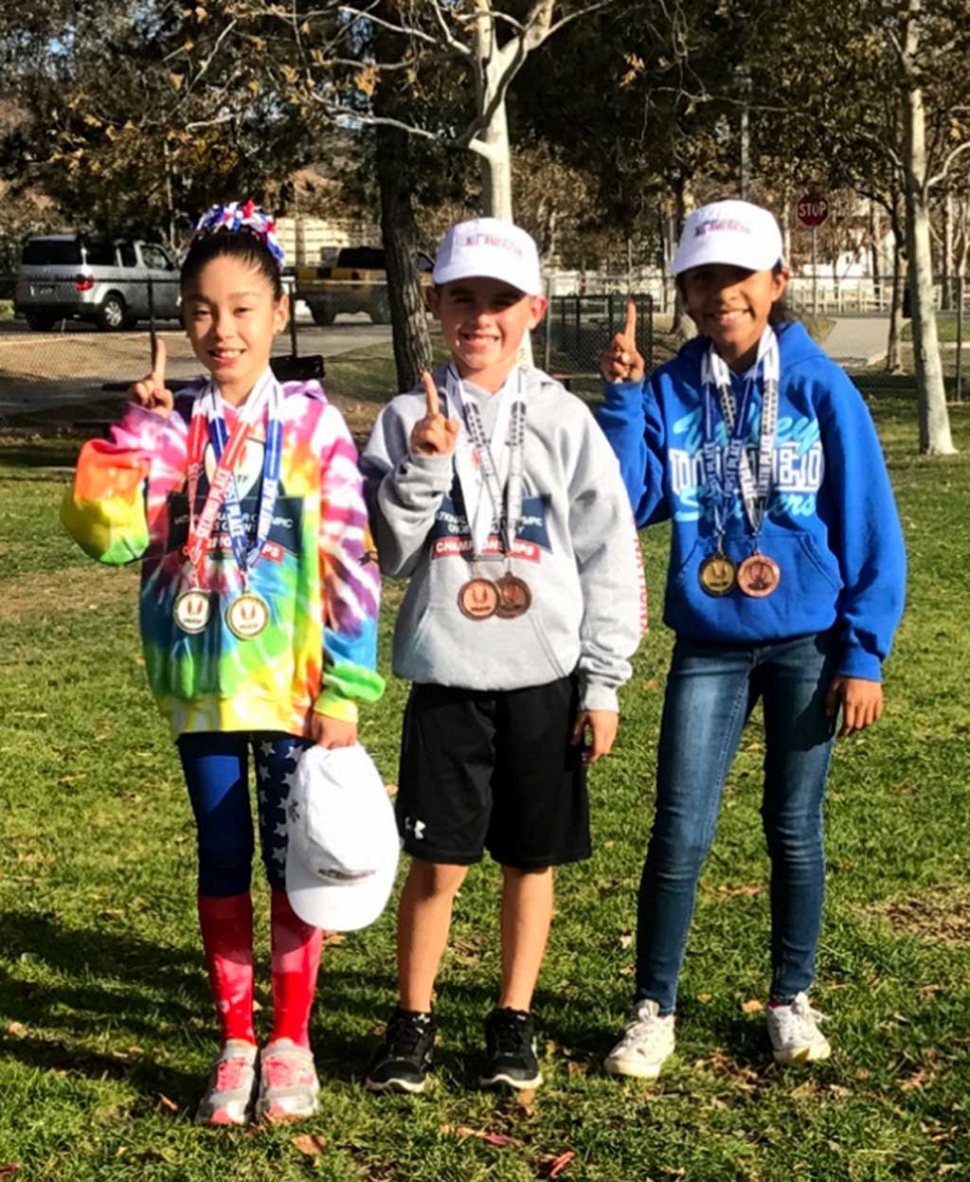 (l-r) Paola Estrada, Ayden Marquez and Niza Lauerano who were named All American Athletes at the USATF Jr. Olympic Cross Country National Championships. Photo Courtesy Erika Arana.