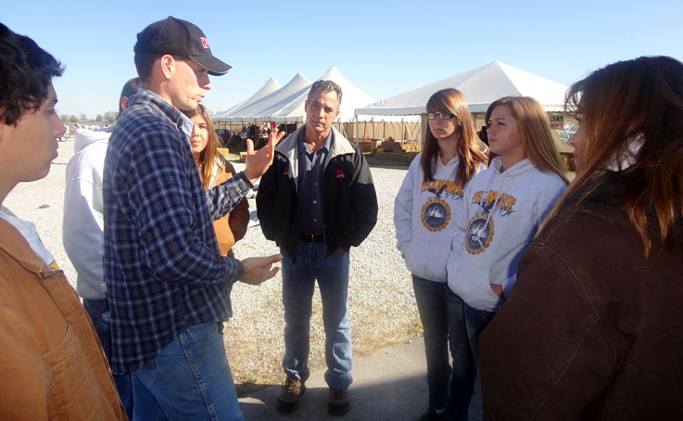 Listening to the farm manager at Kelsey Dairy Farm while he gives us a tour of the farm.