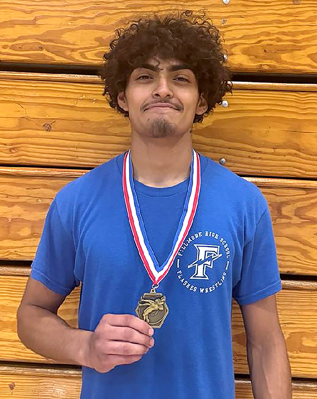 Flashes Tony Lemus who placed 1st in the tournament. Photo credit Boys Wrestling Head Coach Manuel Ponce. 