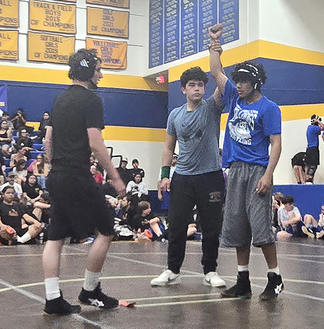 Pictured is Bulldogs Cayden Balades after winning his match. Photo credit Michael Torres & Cindy Vazquez.