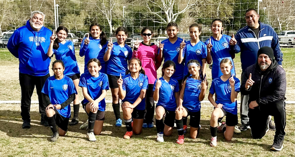 Pictured above is California United FC 2013. Girls Top Row: Coach Daniel Garcia, Siani Lomeli, Sadie Manriquez, Sarai Prado, Aaliyah Cervantez, Cristine Beltran, Bella Mendez, and Assist Coach Tony Mendez. Bottom Row: Marianna Guzman, Eva Arroyo-Salinas, Alessandra Padilla, Toni Cervantez, Itzel Arana, Hanna Sasson, and Head Coach Jose Luis Lomeli Jr. Not Pictured: Marianna Arreola.  Photo credit CUFC Publicity Erika Arana.