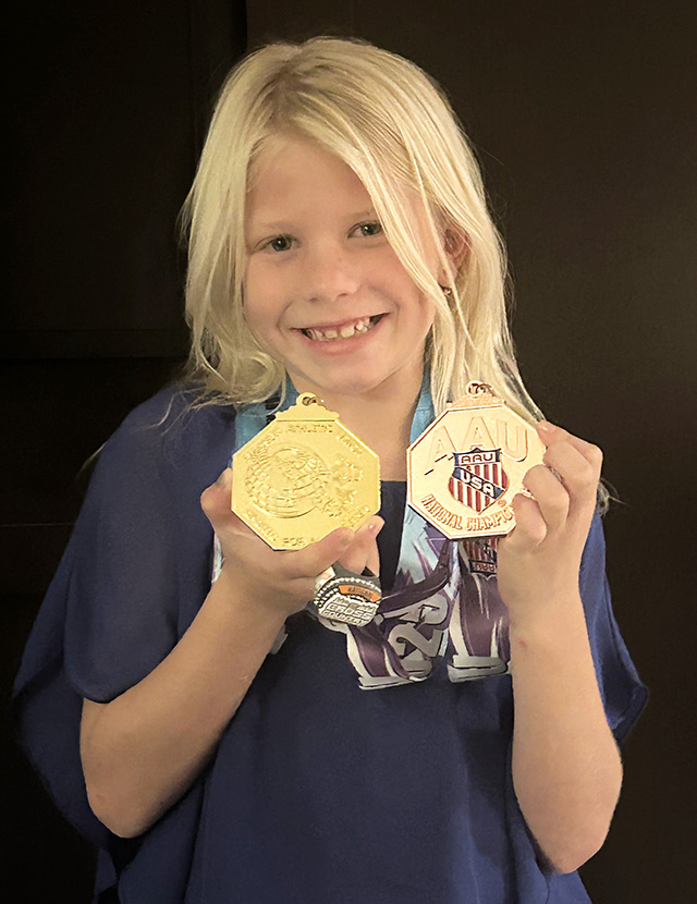 Pictured above is Fillmore Condors Eva Dunlap and her awards. Photo credit Head Coach Kenny Leighton.