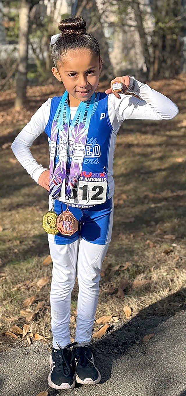 On Saturday, December 6, 2025, multiple local youth from the Fillmore Condors Youth Cross Country Club competed at the AAU National Cross Country Championships in Knoxville, Tennessee. Pictured is McKayla Magana with her medals. Photo credit Head Coach Kenny Leighton. 