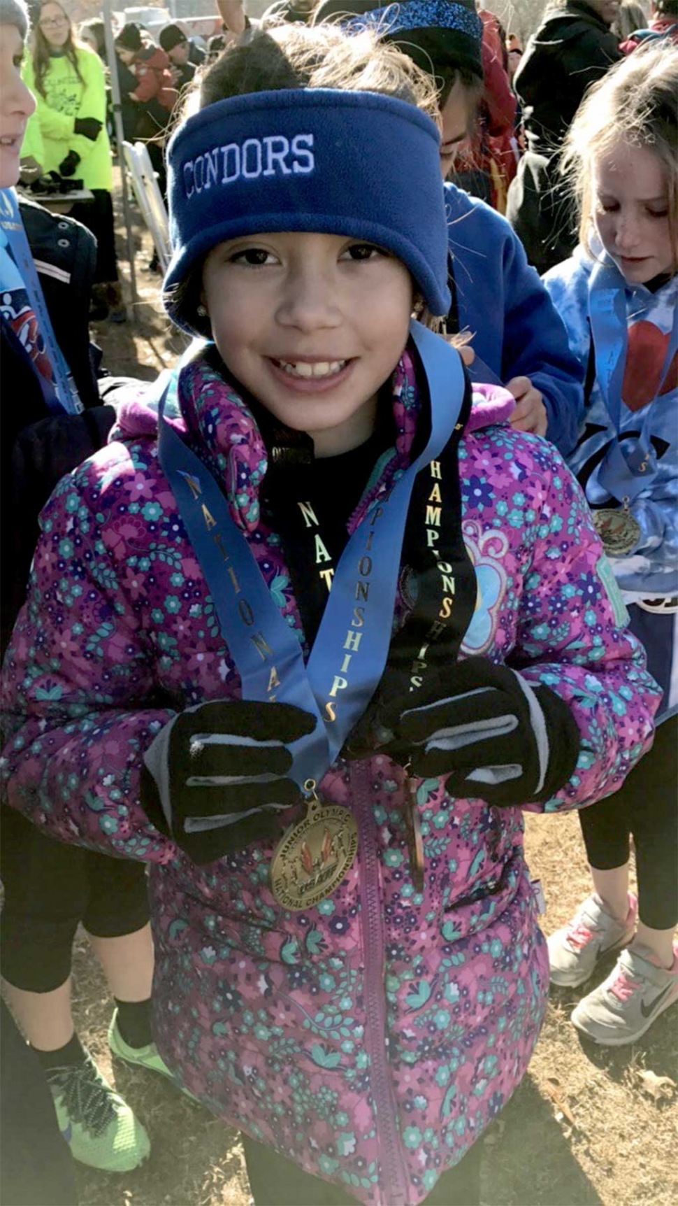 Seven year old Paola Estrada received medals for placing 9th out of 120 runners in the 8 & under division in Alabama.