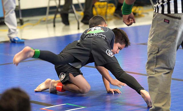 Pictured right is Dax Camacho vs. Zeke Zendejas during the 1st Annual Barbara Webster Takedown Tournament. Photo credit Gabriel Salazar. 