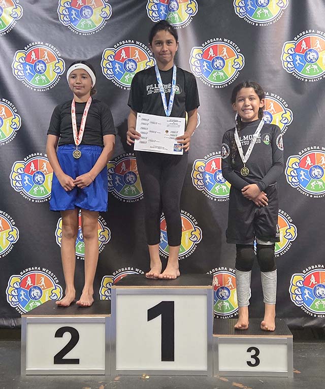 On Saturday, June 27, Fillmore Jiu-Jitsu students competed at the 1st Annual Barbara Webster Takedown Tournament in Santa Barbara. Pictured above (l-r) are Valarie Ramirez of Barbara Webster; Kamila Cuesta of Fillmore took 1st place and Amelia Andrade of Fillmore took 3rd place. Photo credit Gabriel Salazar.