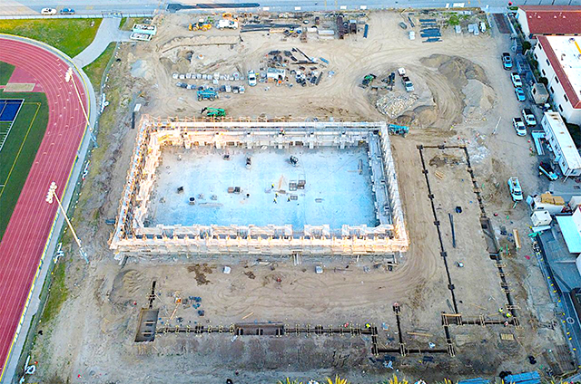 Crews have competed trenching for footings and caisson layout.