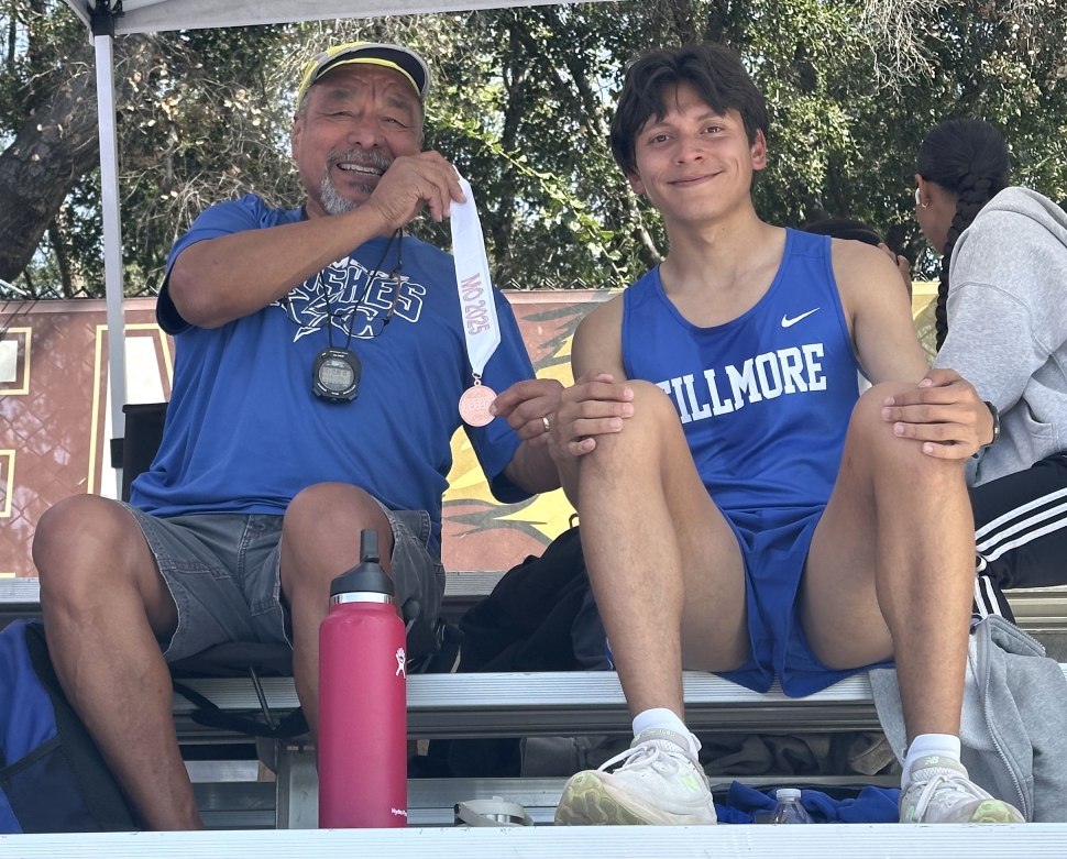 Above is Fillmore’s Omar Heredia who medaled in the 1 Mile, pictured with Coach Epi Torres at the Maurice Greene Invitational. Photo credit Anthony Chavez.