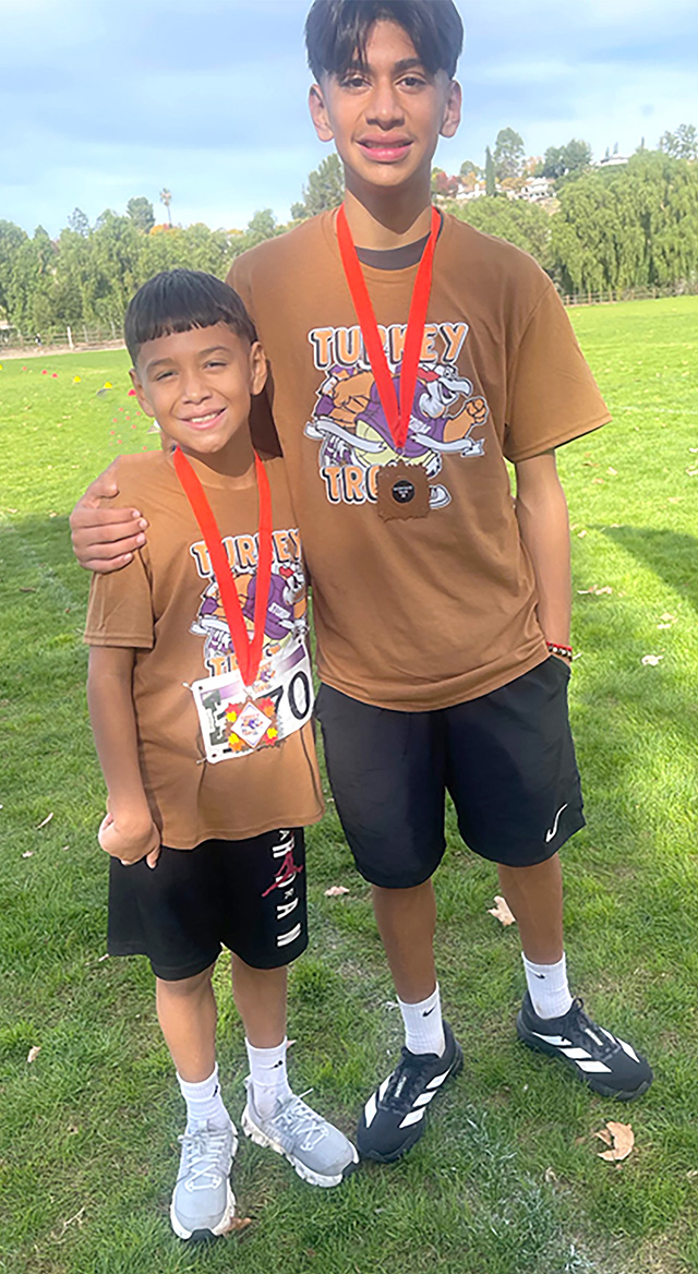 Pictured is Fillmore’s Damian Santa Rosa and his brother Jacob, medal winners at the Santa Clarita Valley Turkey Trot.