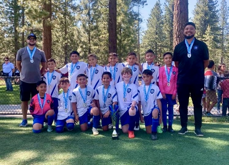 Fillmore’s California United FC 2104 Boys Team: Top row (l-r): Coach Francisco Aguayo, David Gonzalez, Caesar Aguayo, Romero Ochoa, Jacob Santa Rosa, Luis Ortiz, Elijah Vargas, and Coach Miguel Martinez. Bottom row (l-r): Michael Ortiz, Andre Mendez, Noah Jimenez, David Prado, Bane Brawders, and Moises Pastrana. Not pictured: Joesph Lomeli and Kristopher Alvarez. Photo credit CUFC.