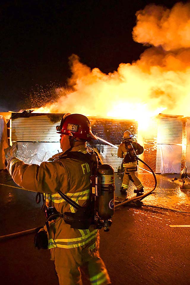 On Saturday, July 4, multiple units responded to a fire at Fillmore High School and found construction materials in the campus parking lot engulfed in flames. After several hours of batting the fire it was extinguished. Authorities are asking for tips: scan the QR code provided on page 1 to contact deputies. Photo credit Angel Esquivel.