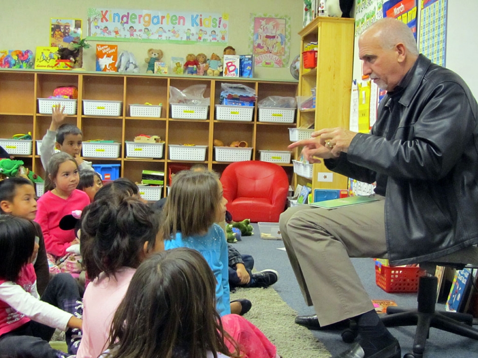 Superintendent, Jeff Sweeney preparing to read the “Foot Book: by Dr. Seuss to Mrs. Davis’ Kindergarten class.