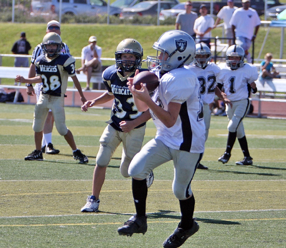 #1 Ryan Riberty throws his first TD pass to #12 Aaron Cronin. All photos by Harold Cronin.