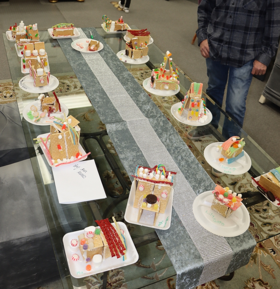 On Friday, December 1, Fillmore hosted the Annual Tree Lighting Ceremony for the City of Fillmore, a tradition to kick-off the Christmas season. The night was filled with Christmas music and cheers, food and shop venders, and fun activities for the kids; one being making gingerbread houses. Picture right are the final creations of the kids who participated. Below are two girls smiling for a photo with their completed gingerbread house. Photo credit Angel Esquivel-AE News. 