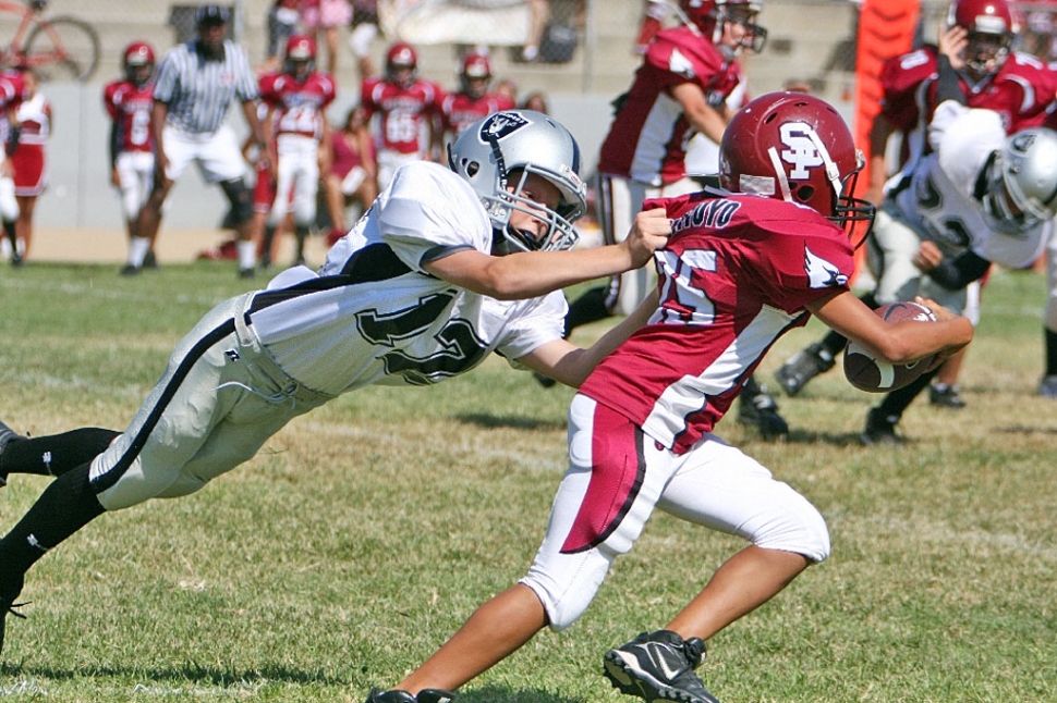 Aaron Cronin taking down a Cardinal ball carrier.