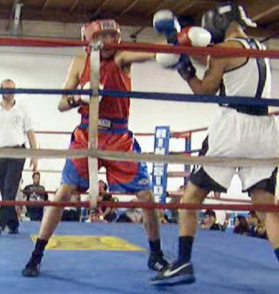 Jonathan (red jersey) throws a jab.