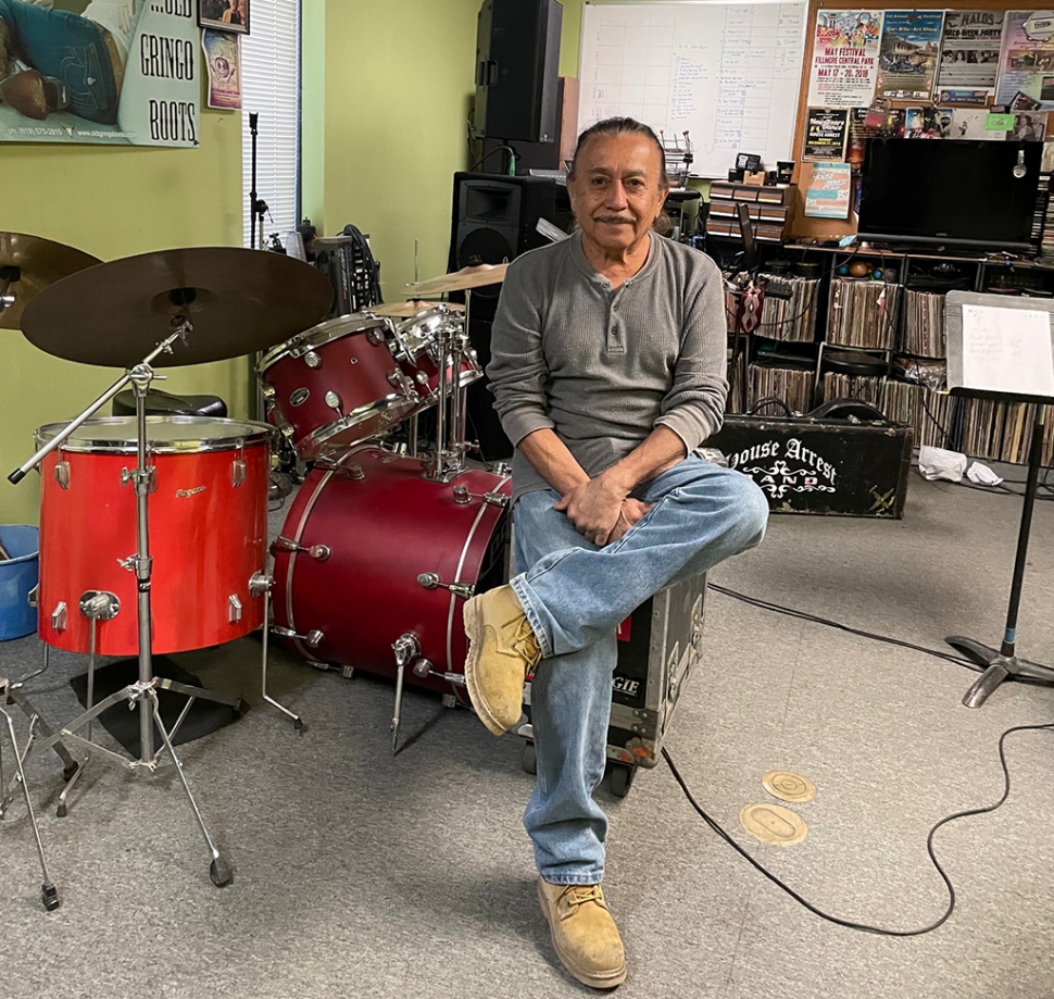 (above) Long time Fillmore resident John Grimaldo in his music studio. John has an auto repair shop in Fillmore, is a professional ceramicist, and is popularly known for his musical band “House Arrest.” Photo credit Carina Monica Montoya.