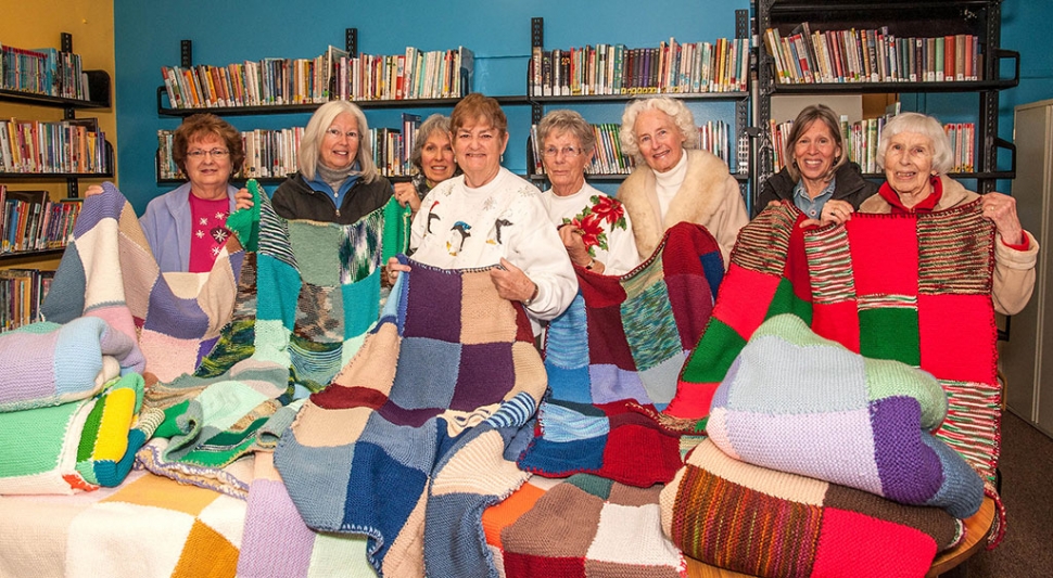 Knitters (l-r) Joan Padilla, Kit Willis, Silvia Basich, Sue Dickens, Sally Dunio, Carolejo Adams, Lanae Carter and Alyce Barnwell. Other knitters not pictured are Nancy DeGroot, Marge Hatton and Charlene Hartenstein.