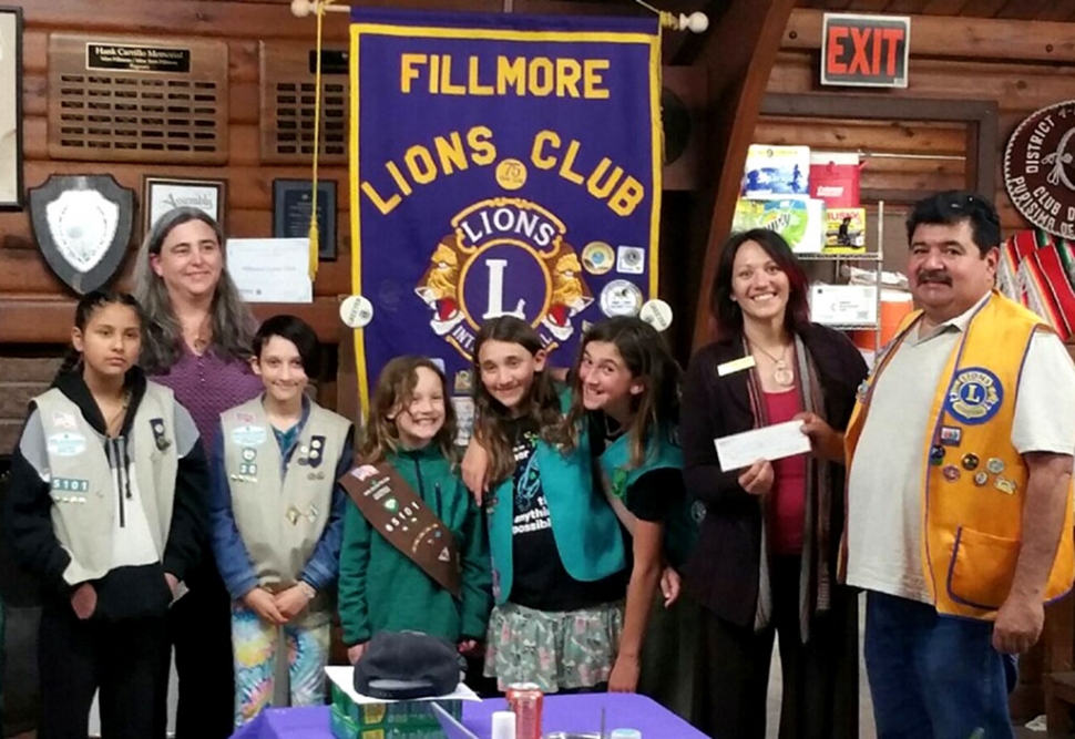 The Fillmore Lions Club presented a $300 check to Fillmore Girl Scout Troop 65101 to attend camp. Pictured left to right is Heather Merenda, Diamond Mendoza, Aurora LaRaia, Mable Lengning, Aine LaRaia, Rosetta Merenda, Brandy Lengning, and Ed Barajas of the Fillmore Lions Club. Courtesy Jan Lee.