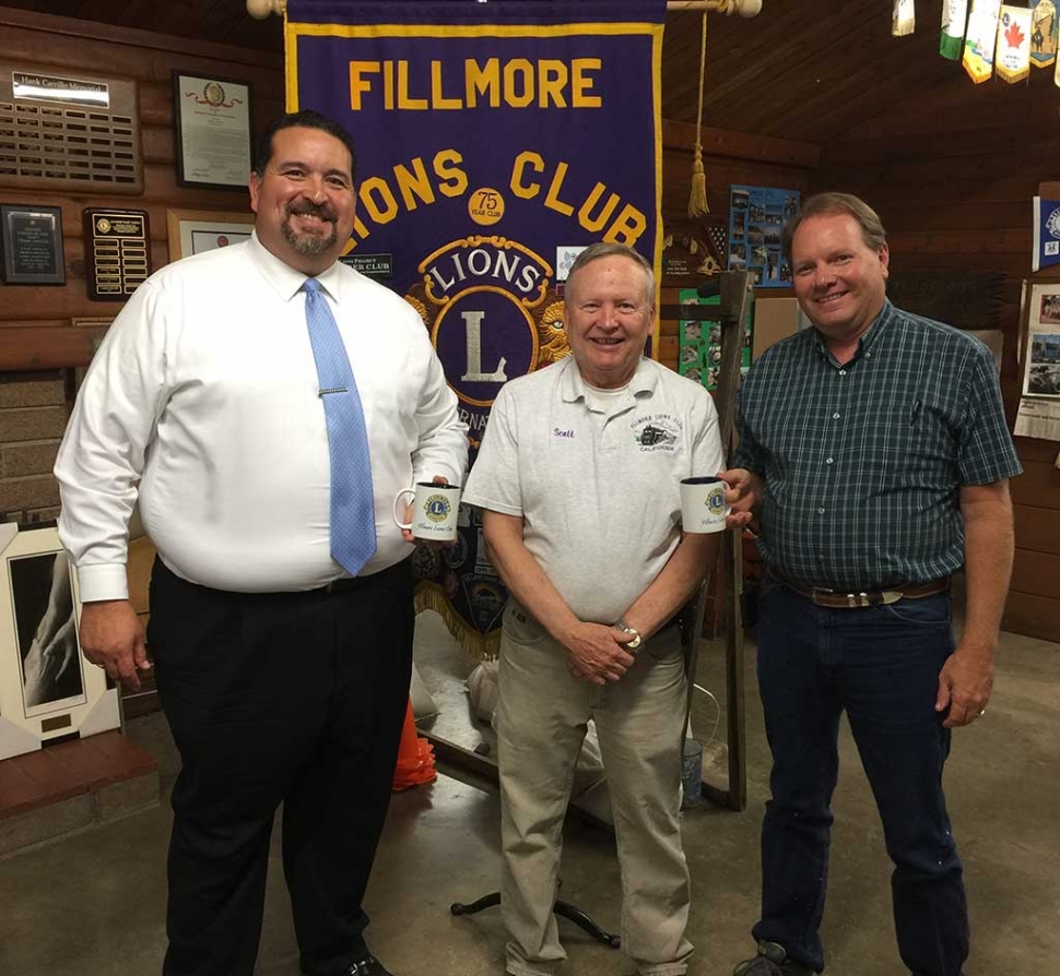 Fillmore Unified School District Superintendent Dr. Adrian Palazuelos and Board Member Scott Beylik recently spoke to the Fillmore Lions Club. They talked about the schools and the need for modernization and long-overdue upgrades and repairs, especially at Fillmore High School. They urged support for Measure V on the November ballot, which would fund $35 million in improvements. (Above) Superintendent Palazuelos (left) and Beylik (right) received Lions Club mugs from Lions President Scott Lee.