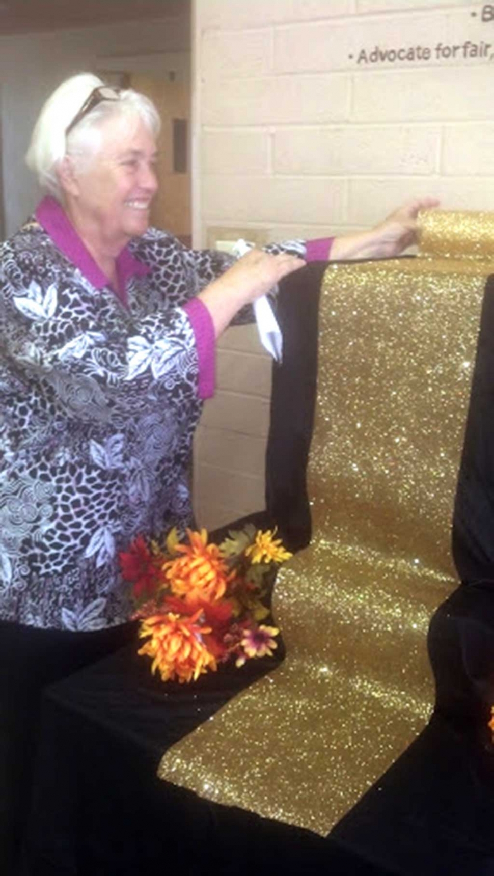 Edmonds setting up an altar for Dia de los Muertos