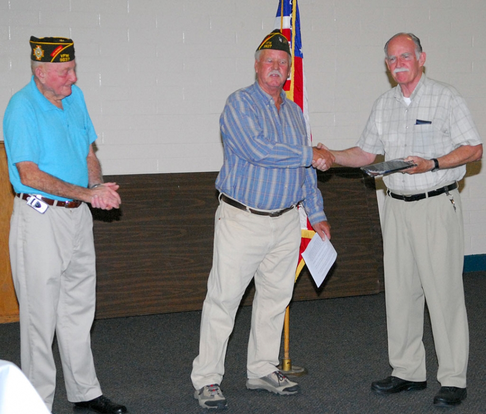 Fillmore Gazette publisher Martin Farrell received a plaque Tuesday night from the Veteran’s of Foreign Wars Post 9637 for his support and dedication to the VFW. Left to right, John Pressey, Victor Westerberg are shown with Farrell.