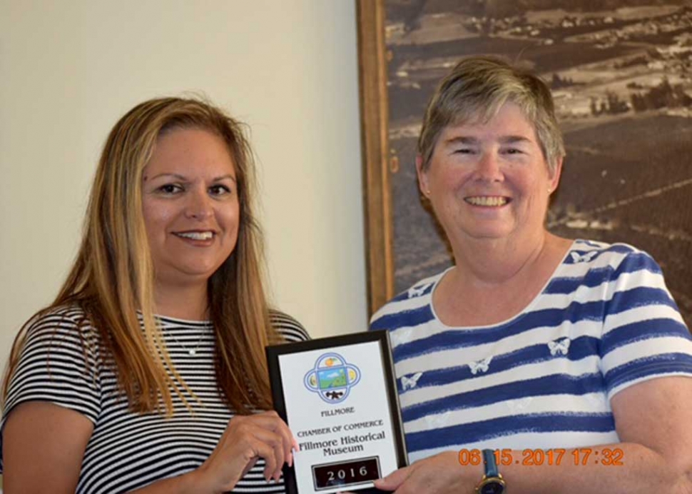 (l-r) Fillmore Chamber of Commerce board member Ari Larson presents Martha Gentry, board president of the Fillmore Historical Museum with their membership plaque. The Fillmore Historical Museum is busy planning the 90th Anniversary of the St. Francis Dam Commemorative event slated for Saturday, March 17, 2018. For questions regarding the Fillmore Chamber and/or the 90th Anniversary of the St. Francis Dam commemorative event please contact Ari Larson 805.794.7590 or petenari55@hotmail.com.