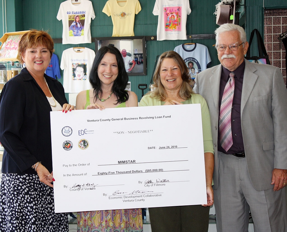 Pictured (l-r) Supervisor Kathy Long, Mimstar owner Karen Thayer, Fillmore Mayor Patti Walker, and Joe Palmer, EDC-VC loan officer, celebrate at the recent check-passing ceremony.