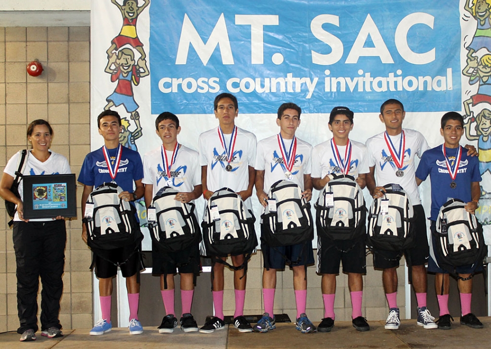 Boys Varsity Sweepstakes (Division IV) (l-r) Ms. Tafoya, Jose Almaguer, Nicolas Frias, Isaac Gomez, Alexander Frias, Anthony Rivas, Hugo Valdovinos and Adrian Mejia.