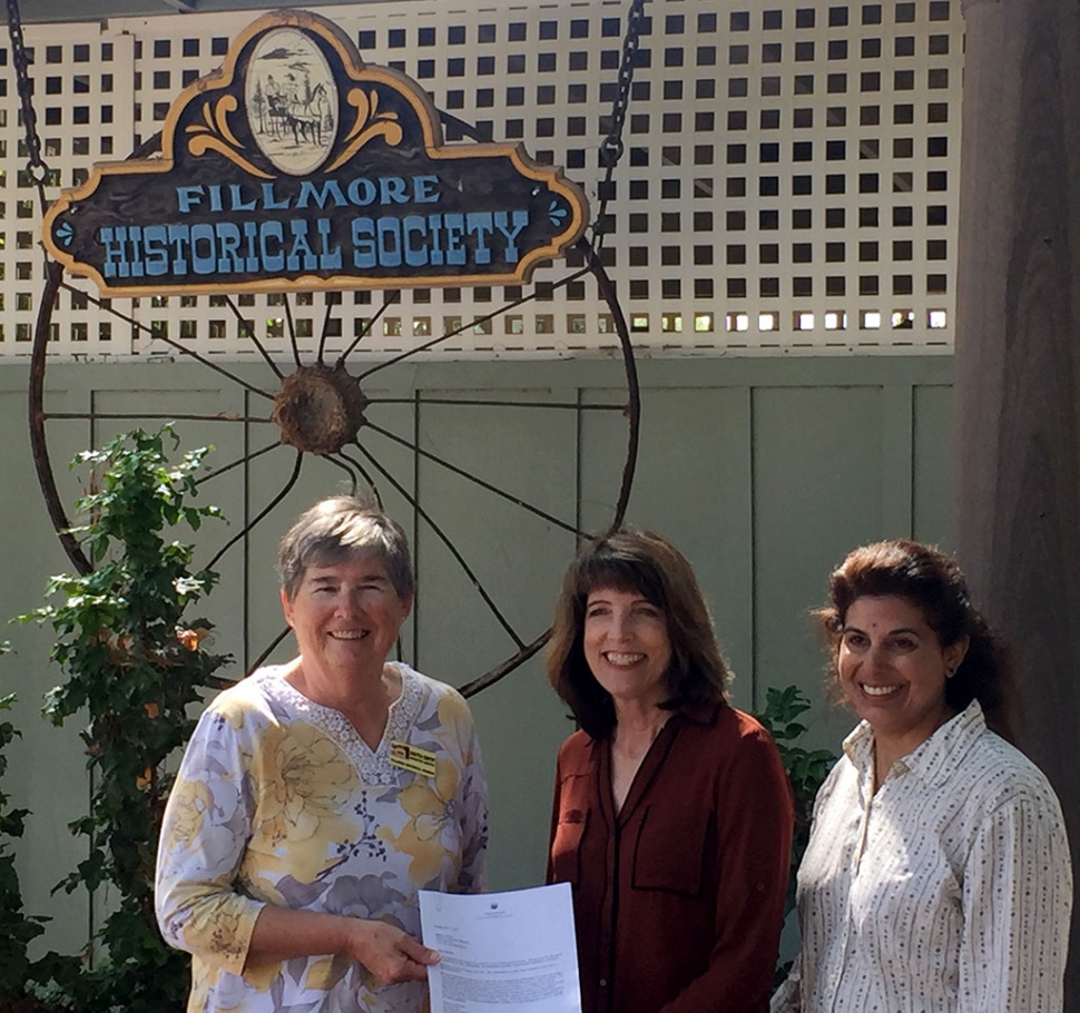 Pictured (l-r) is Martha Gentry, Executive Director Fillmore Historical Museum, receiving a $1,000 check from Leslie Klinchuch and Natasha Molla, Project Managers of Chevron Corporation.