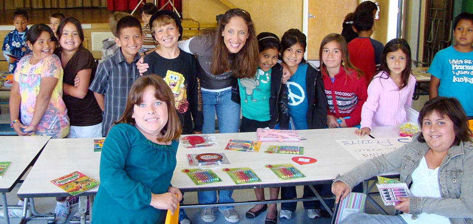 Paula Phillips from the Dream Fund Outreach Foundation is shown with some San Cayetano students in a “Rewards Store” she set up in the school cafeteria. Students who have been recognized during the year as a Character Counts or Peacebuilder receives an invitation to “Shop” in the store. The school also celebrates with a pizza lunch for all students as San Cayetano is a school of service and each class has given back to our local community.