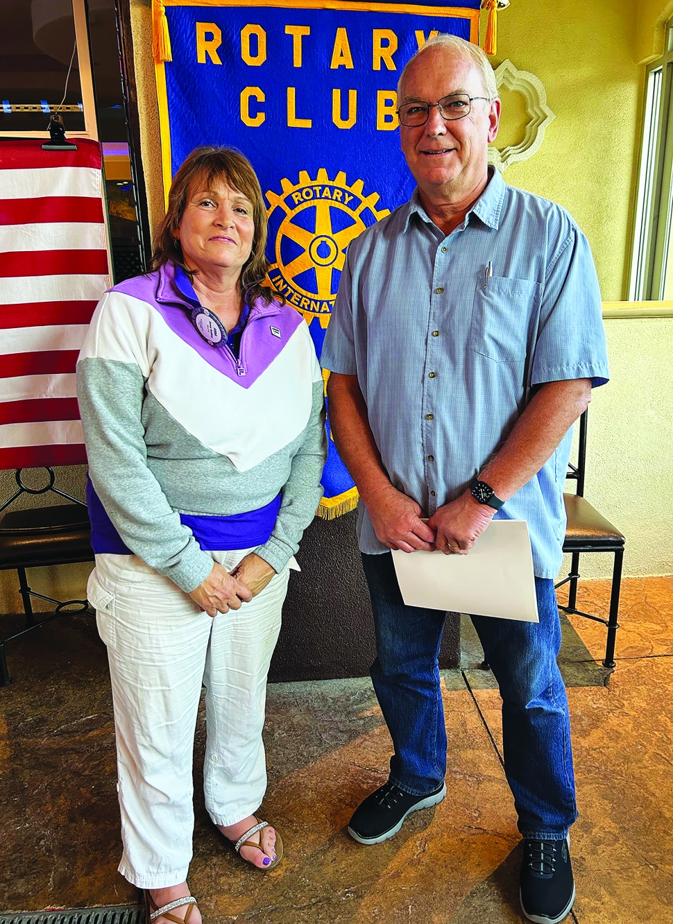 At last week’s Rotary Club of Fillmore meeting, President Anna Reilley inducted new member Gary Cushing into the club. Photo Credit Martha Richardson.