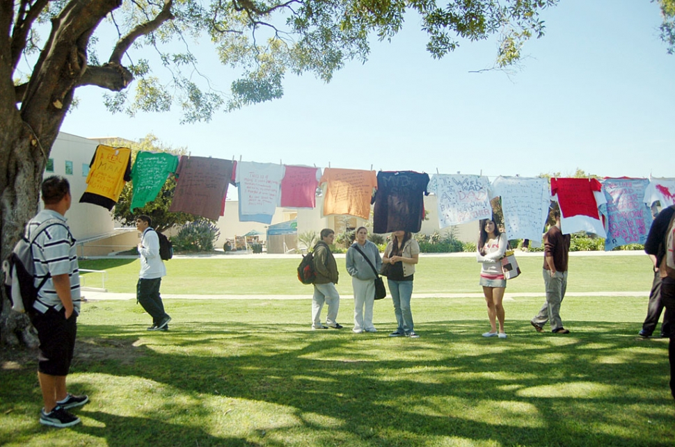Students and other members of the community make t-shirts to honor those hurt by domestic violence, date rape and other forms of anger at the Clothesline Project at Ventura College.