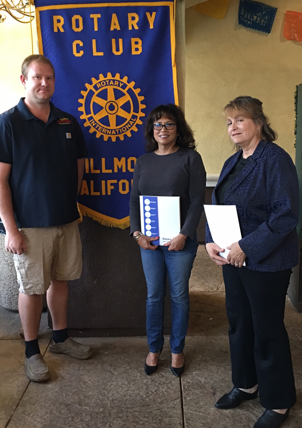 Pictured is Rotary President Andy Klittich inducting two new members into the Rotary Club of Fillmore: Carina
Forsythe and Anna Reilley. Photo credit Rotarian Martha Richardson.