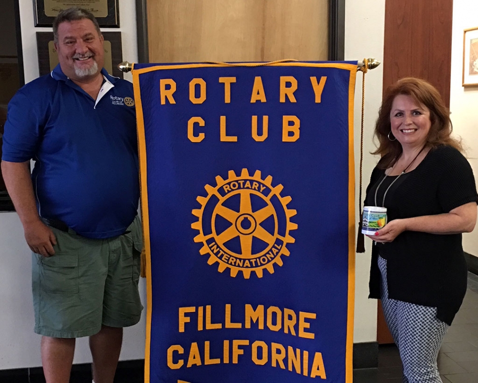 Club President Dave Wareham presented a Rotary mug to fellow Rotarian Theresa Robledo who gave a Kraft talk about her family, education, and former jobs as Legal Secretary, Paralegal and Freelance Paralegal. After she and her husband Henry started Diamond Realty they knew they wanted to give back to the community, especially the youth. They hosted a gallery of art from Boys & Girls Club, a Youth Chalk Art contest this past May and have posted congratulations signs for the CIF Champions and much more. Photo courtesy Martha Richardson.