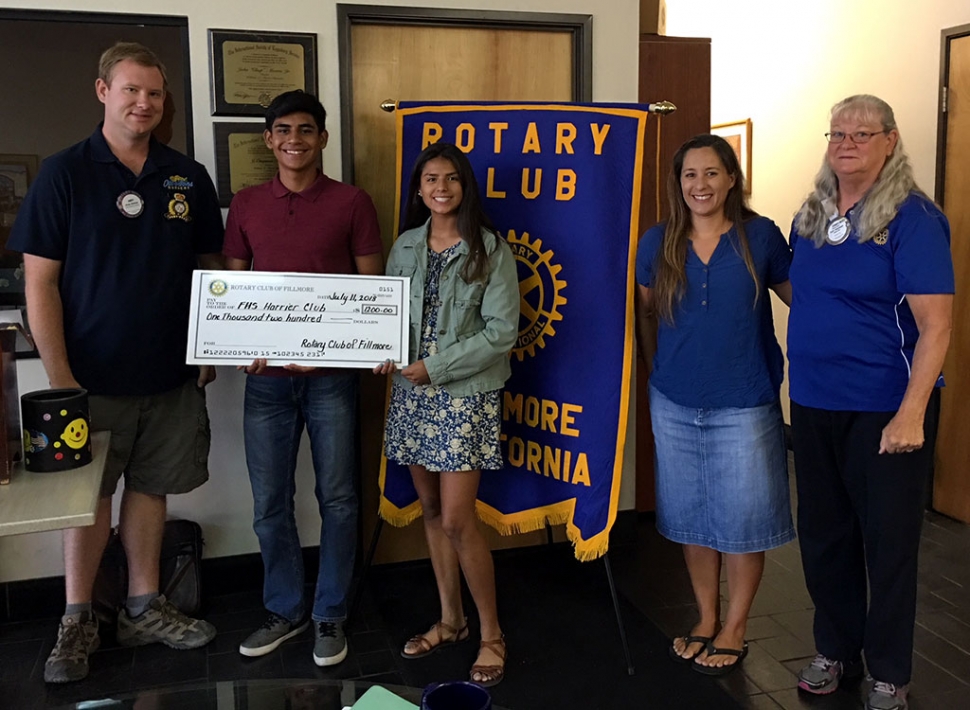 President Andy Klittich (left) presented a check for $1,200 to the FHS Harries Club. $1,000 was directly from Fillmore Rotary, $150 was from FHS Cross Country team’s first place time in the 5K Run and $50 was a donation from Pro Body Fitness, from Santa Paula, who placed second in the 10K Run. Accepting the donation was Nick Villela, Vanessa Avila, and Coach Kim Tafoya and also Cindy Blatt who was Chair of the Runs. Photo courtesy Martha Richardson.