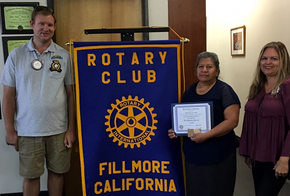 President Andy Klittich (far left) and Ari Larson (far right) recognized Concepcion Santa Rosa Cruz one of the local Crossing Guards for keeping our children safe. Two other Crossing Guards Elizabeth Ramirez and Lisa Benfield were also recognized, but unable to attend. Photo courtesy Martha Richardson.