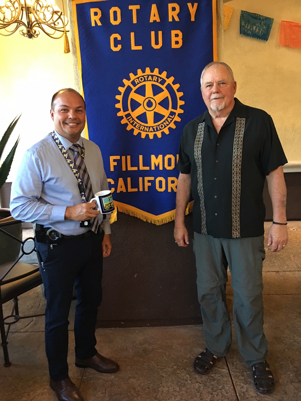 The latest speaker at Fillmore Rotary was Dave Songer, Detective Assistant to the DA and grandson-inlaw of Pastor George Golden. Dave has spent the last 34 years in various areas of law enforcement. He has been to many mass shootings and other emergency situations and has put together a program on how to prepare and what to do if you are involved. He has trained police, sheriffs, CHP, firefighters and FBI. Communication and preparation to be mentally prepared is the key. Dave told Rotary how most people react when faced with a bad situation: denial, freeze, etc. He gave us instructions on how to avoid a problem, such as being aware of your surroundings and have a plan of what to do if something happens. The plan will consist of recognizing the situation is real; mentally this prepares your brain to react so you can do what you need to do. Pictured (l-r) are Dave Songer with Rotary Club President Dave Andersen. Photo Credit Martha Richardson.