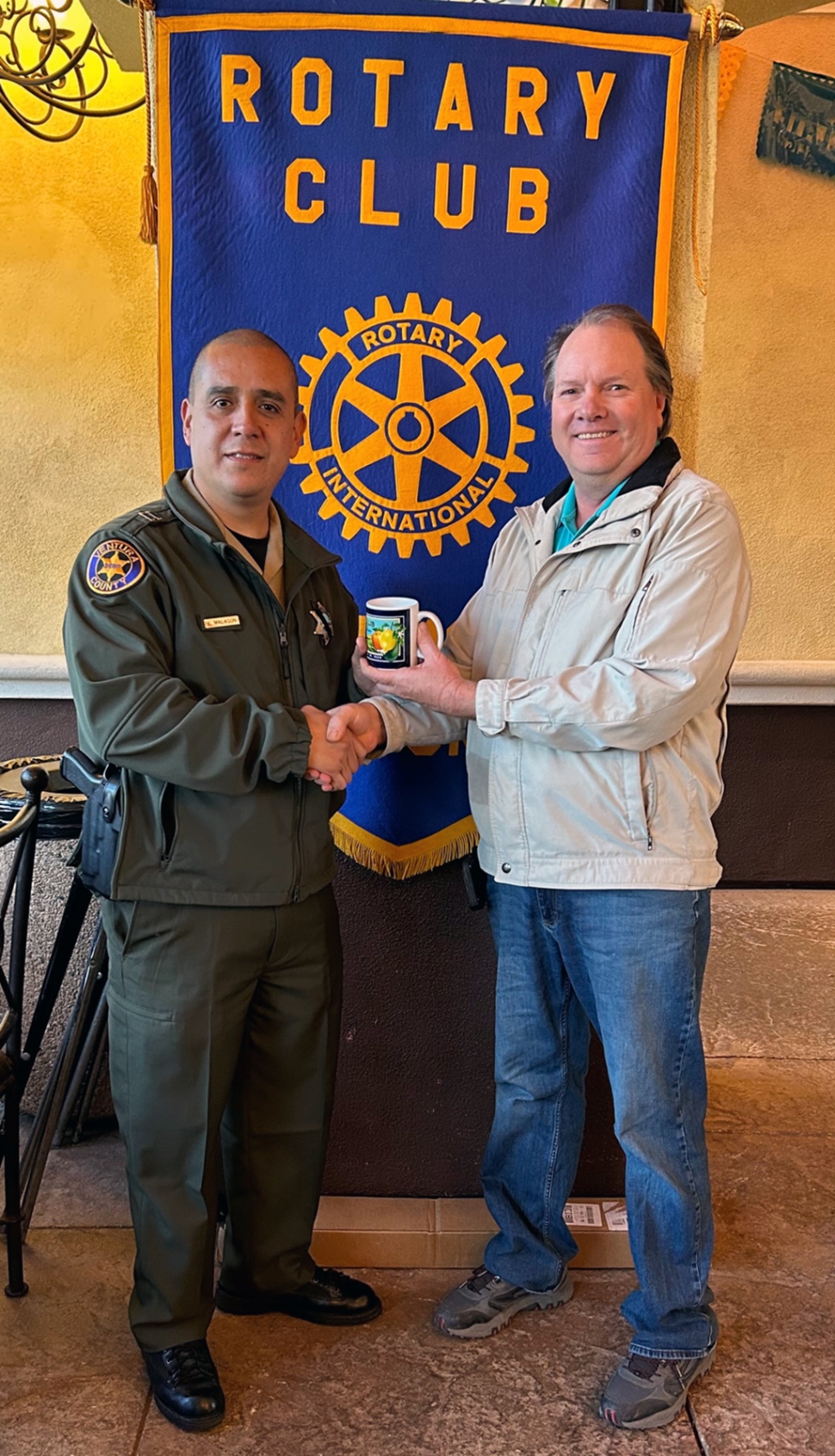 (above) (l-r) Fillmore Police Chief Eduardo “Lalo” Malagon and Rotary President Elect Scott Beylik. The Fillmore Rotary speaker last week was new Police Chief Eduardo “Lalo” Malagon. Chief Malagon began his career as a Sheriff’s Cadet in 2000 and has worked his way up as an Investigator, Patrol Officer, Special Crimes, Gang Enforcement and Swat Team. He also worked at the jail and in dispatch. All this experience has now led him to Fillmore. The Chief is working on ways to engage Fillmore students with officers in positive ways and stresses that law enforcement wants to build friendship with the community. He suggested that we all engage with the Fillmore officers and just talk and get to know them. Photo courtesy Rotarian Martha Richardson.