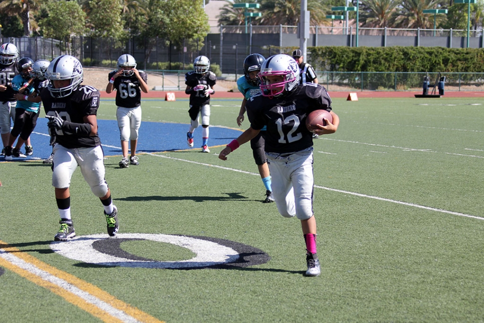 Raiders Junior's #20 blocks for #12 to get the first down and more