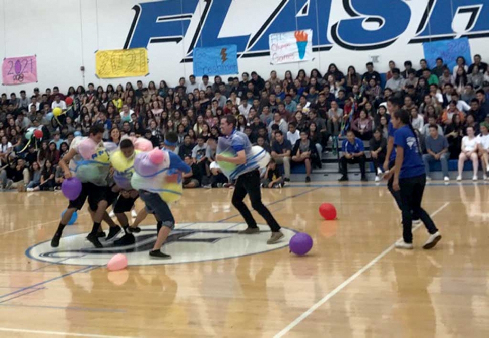 Friday, August 25th, Fillmore High School hosted their Welcome Back Rally. The theme was the Olympic Games. Students are throwing a noodle through the hula hoop rings and students and faculty are playing the balloon
bump game. Photos Courtesy Katrionna Furness.