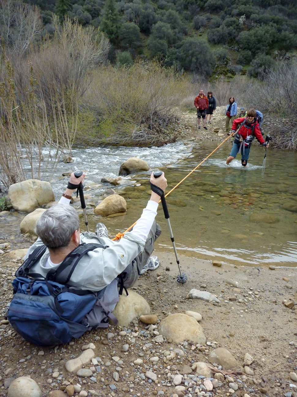 Learning how to get safely across a fast moving creek is practiced by WBC students. Photo by Cara Peden.