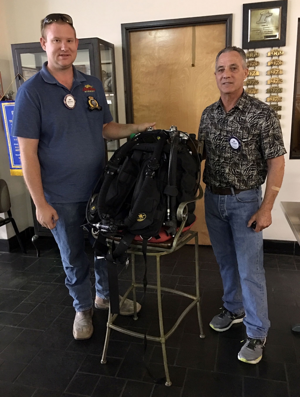 Pictured is Rotary President Andy Klittich with Rotary Member Joe Ricards who presented to the club about being a certified scuba instructor in several specific areas. He brought along his most recent equipment, a rebreather which allows him to stay underwater for up to three hours at 130 feet. He described his dives and places he has gone, and his passion for the sport. Photo courtesy Martha Richardson.