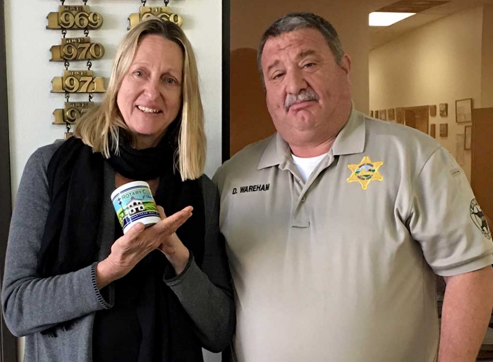 Rotary Club Learns about Roan Mills Bakery. Andrea Crawford from Roan Mills Bakery, receiving a Rotary Mug from Rotary President & Police Capitan Dave Wareham for sharing with the about how her career began growing and selling salad greens to restaurants. Later she expanded to growing wheat, making various breads, pasta, pizza etc. The Bakery can be found on Central Avenue in Fillmore and is open on Wednesday’s and Saturday’s. Photo courtesy Martha Richardson.