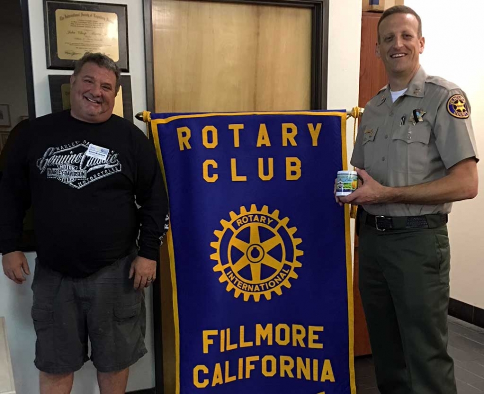 Rotary President Dave Wareham presents a mug to new Fillmore Police Chief Eric Tennessen for introducing himself to the Rotary Club as well as shared about his plans as the new Chief. Tennessen grew up in South Dakota and has lived in California 21 years. He has worked for the Sheriffs Department for 20 years. He is committed to getting involved in Fillmore and meeting the people. Photo Courtesy Martha Richardson.