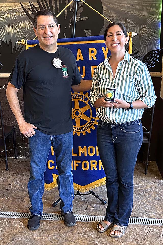 Pictured (l-r) are Rotary President John Garnica and guest speaker Laura Asenas. Photo credit Martha Richardson.
