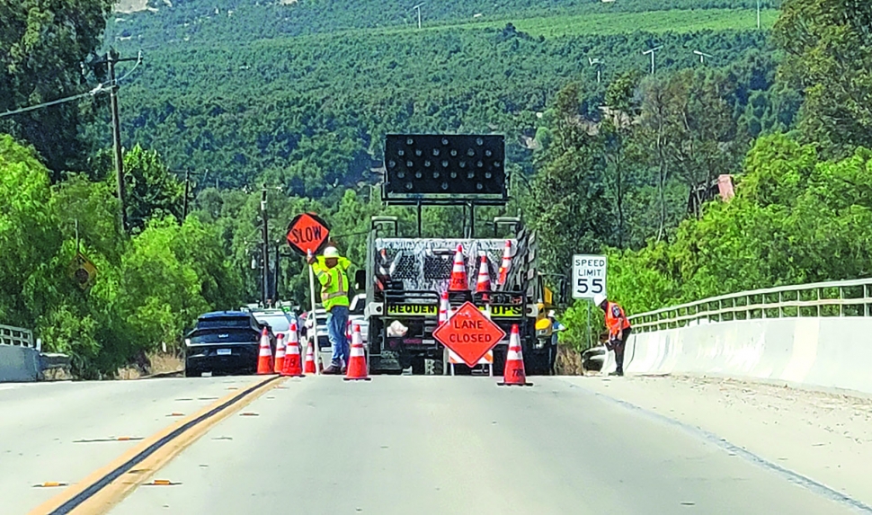 On Friday, September 13, 2024, traffic was delayed for work on Old Telegraph Road which was closed down to one lane due to the Ventura County Transportation Commission doing emergency repairs on the embankment along the Sespe Creek.  Photo credit Angel Esquivel. Inset photo Gazette staff.