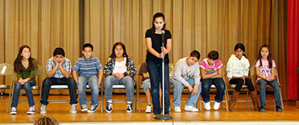 Pictured are the finalists from San Cayetano’s spelling bee . The student at the microphone is our 5th grade winner Priscilla Carbajal who will go on to compete at the next level in Santa Paula.