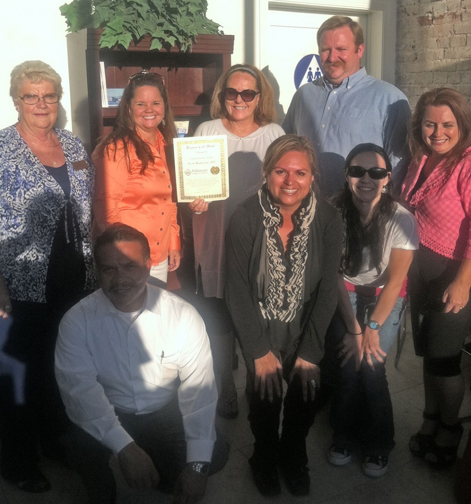 (l-r) Evelyn Hasty, below is Martin Guerro, Cindy Jackson, owner Brenda Ortiz, Ari Larson, Renae Stovesand, Theresa Robledo and next to Brenda is Mayor Rick Neal.