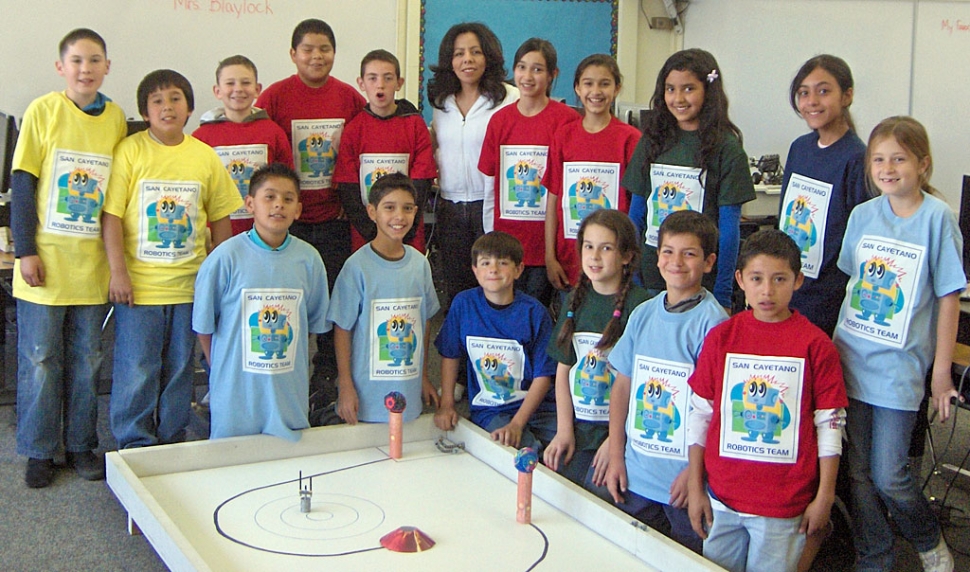 Veronica Morris owner of Water Art Design stands with the San Cayetano Robotics students in T-Shirts that she created for the team. Two teams of four students will compete on March 17th at JPL in Pasadena. The students worked after school starting in January and the students picked which of their peers would represent them at the competition. Fillmore Sunrisers Rotary donated funds to take care of transportation and incidentals for the one day competition . This is truly exciting for San Cayetano to be part of this new adventure.
